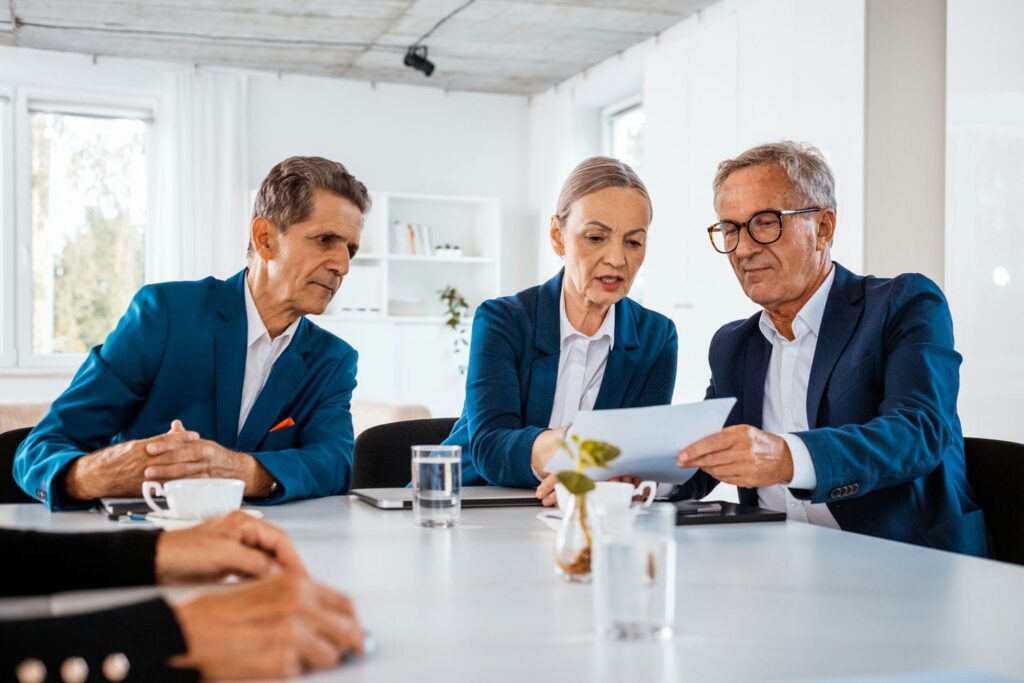 business partners reviewing shareholders agreement
