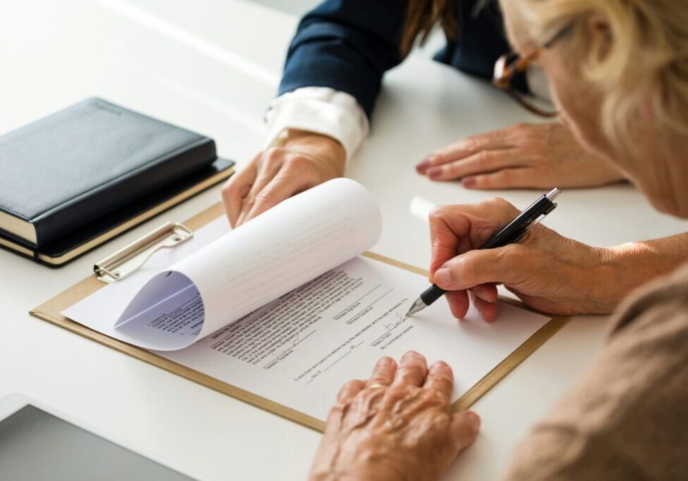 estate lawyer with client reviewing documents